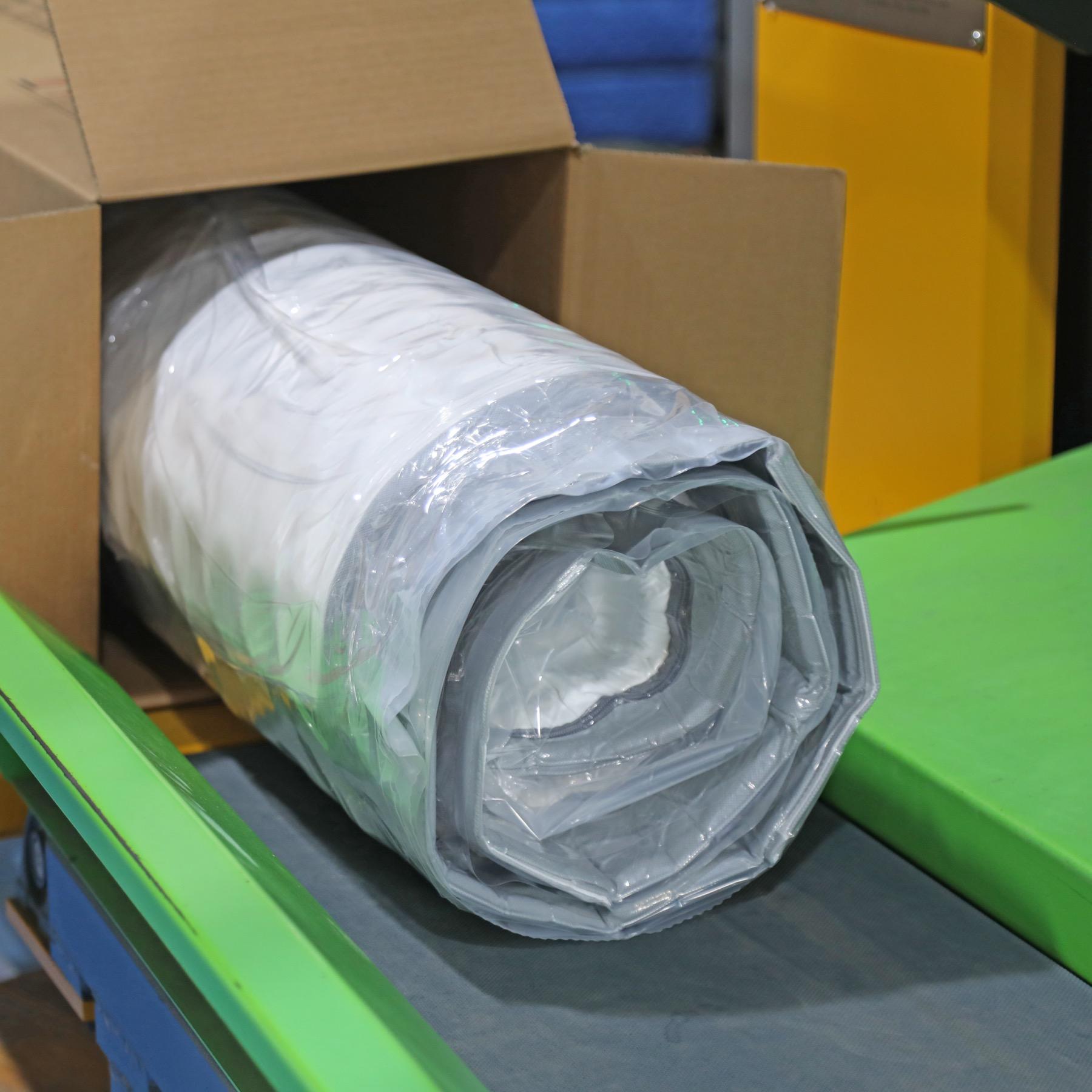 Rolled mattress boxing process for B2B orders